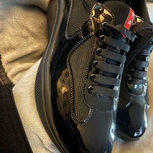 Prada Glossy Black Sneakers with Red Accent